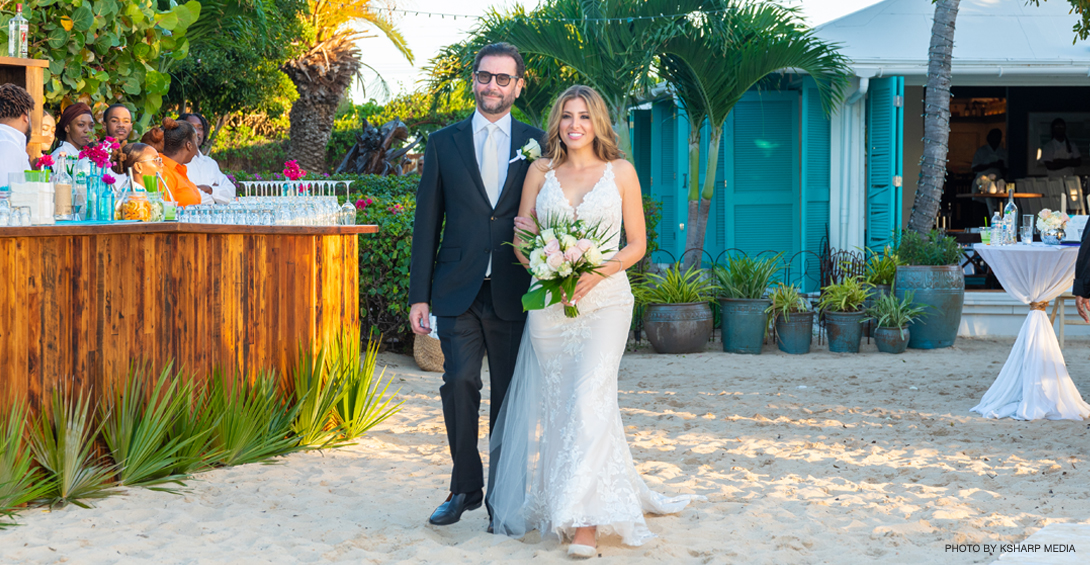 Bride walks down the isle on the beach in Anguilla at Blanchards